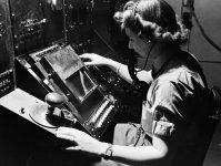 1200px-WAAF_radar_operator_Denise_Miley_plotting_aircraft_on_a_cathode_ray_tube_in_the_Receive...jpg